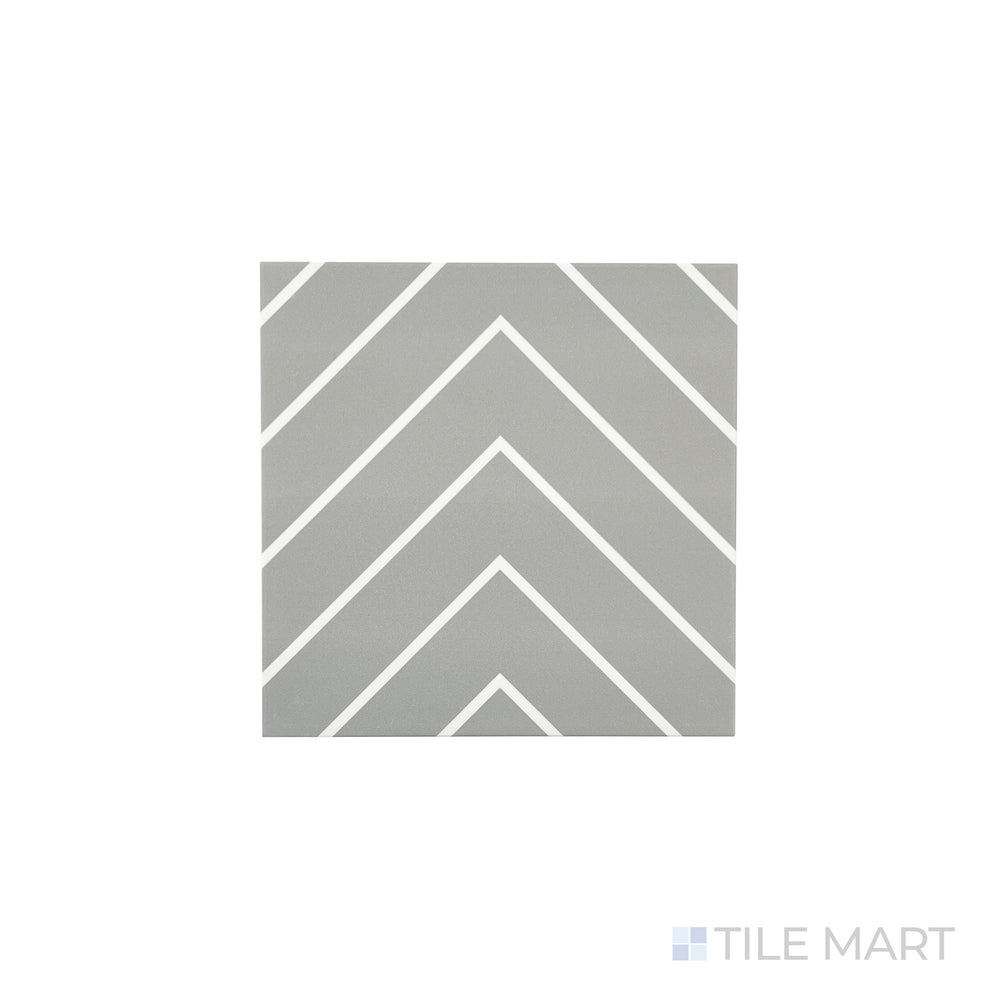 An angled look at the grey with white studio tile, highlighting its glossy finish and the boldness of its warm hue.