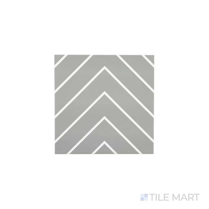 An angled look at the grey with white studio tile, highlighting its glossy finish and the boldness of its warm hue.