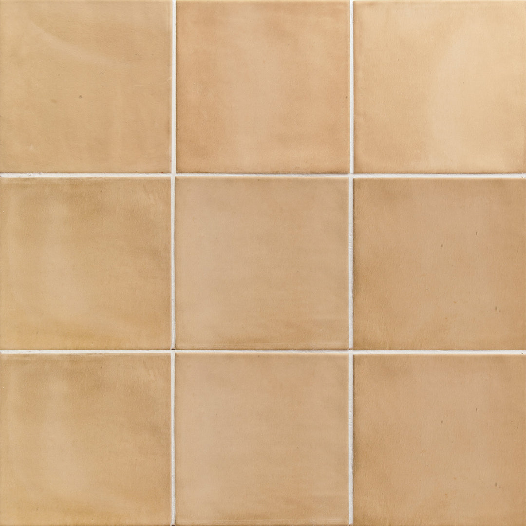 Flat perspective showcasing the square sand clay tile, sized 5x5, with a reflective sheen that enhances its soft undertone.