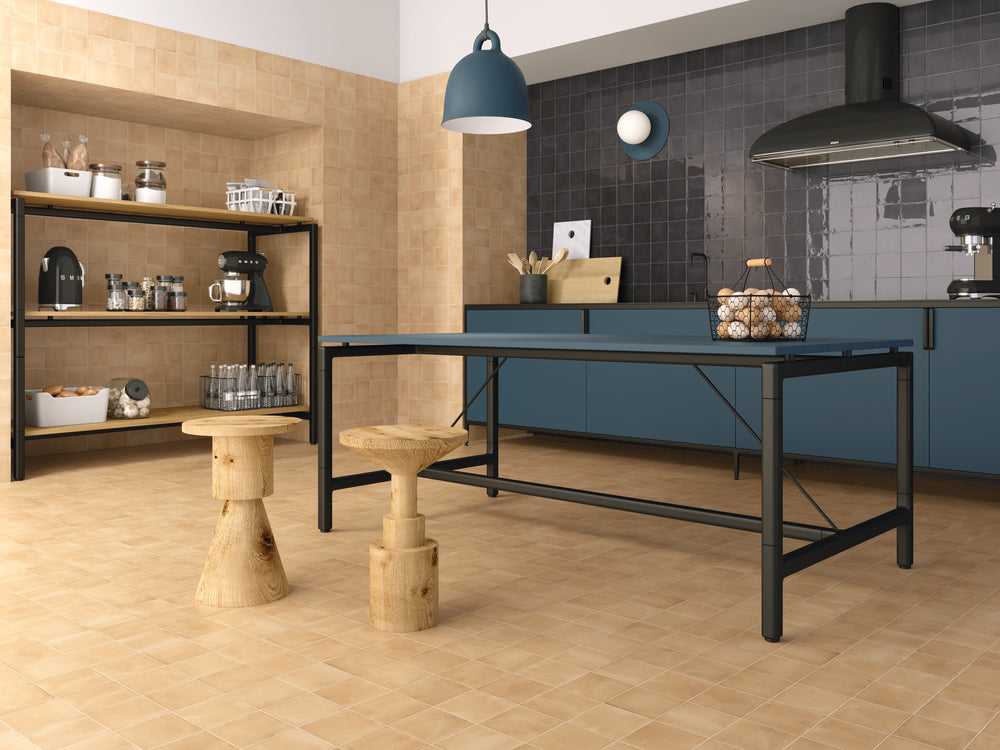 A room scene, featuring square sand clay tile with a matte texture, adding a modern touch to the space.