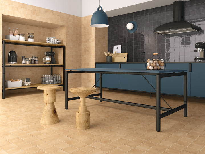 A room scene, featuring square sand clay tile with a matte texture, adding a modern touch to the space.