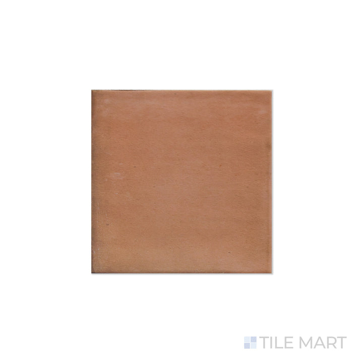An angled look at the square brick clay tile, highlighting its smooth glaze and the boldness of its soft undertone.