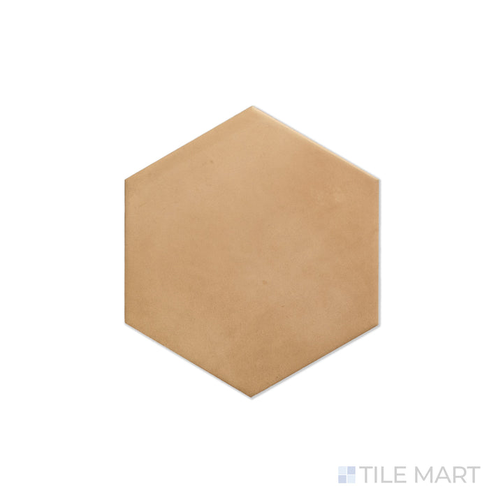 An angled look at the hex sand clay tile, highlighting its smooth glaze and the boldness of its rich pigment.