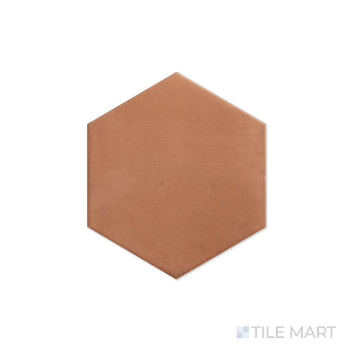 An angled look at the hex brick clay tile, highlighting its glossy finish and the boldness of its warm hue.
