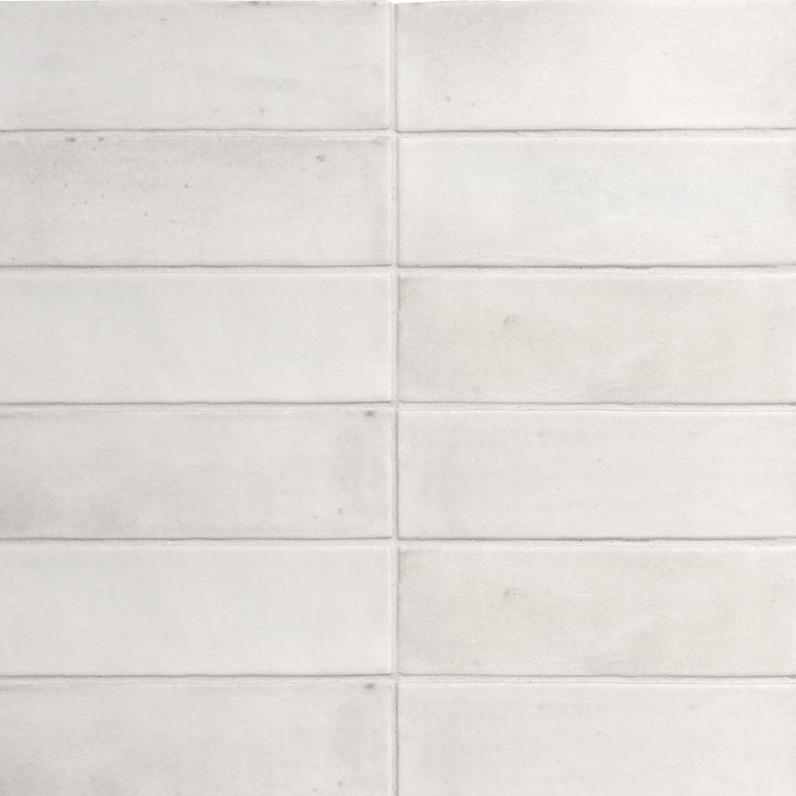 Top angle showcasing the white soco tile, sized 2x6, with a matte surface that enhances its vivid tint.