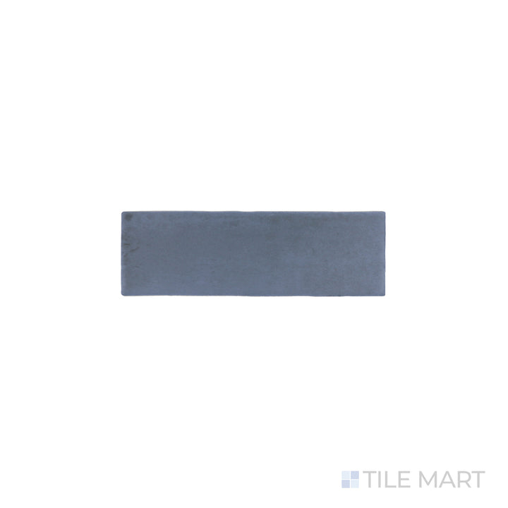 An angled look at the blue soco tile, highlighting its reflective sheen and the boldness of its vivid tint.