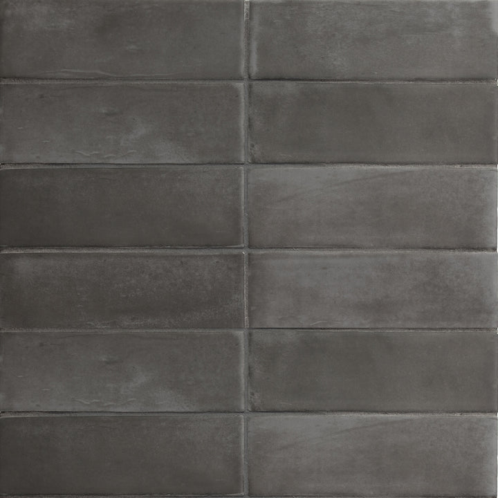 Bird's eye view showcasing the black soco tile, sized 2x6, with a smooth glaze that enhances its warm hue.