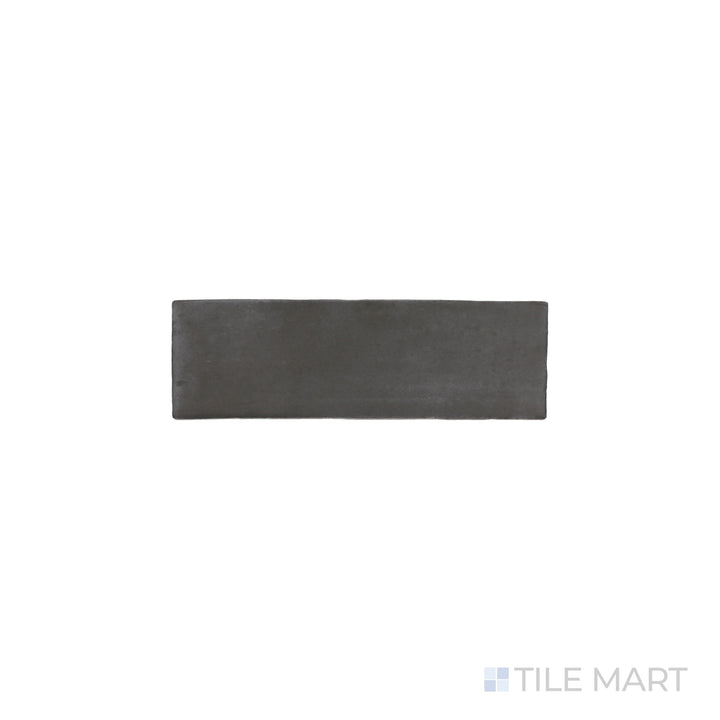 An angled look at the black soco tile, highlighting its glossy finish and the boldness of its soft undertone.
