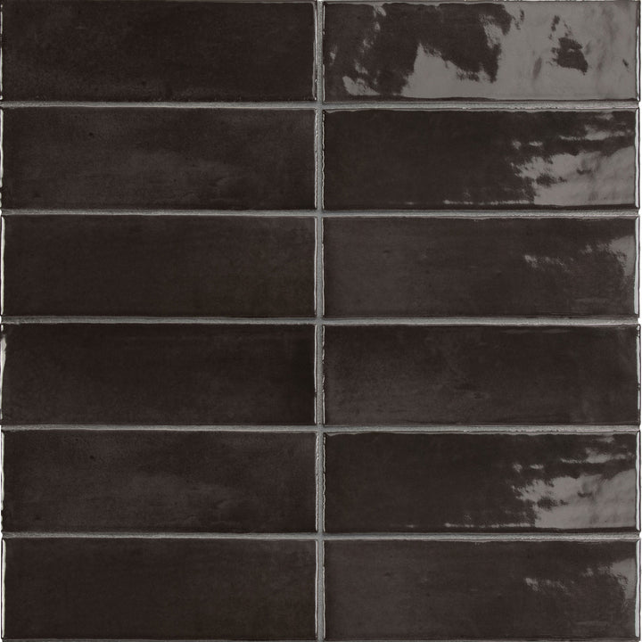 Flat perspective showcasing the black soco tile, sized 2x6, with a glossy finish that enhances its warm hue.