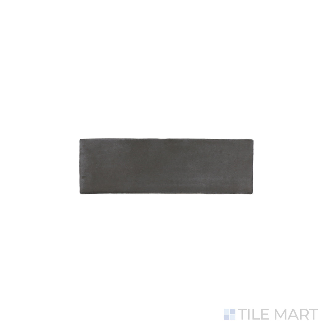 An angled look at the black soco tile, highlighting its glossy finish and the boldness of its soft undertone.