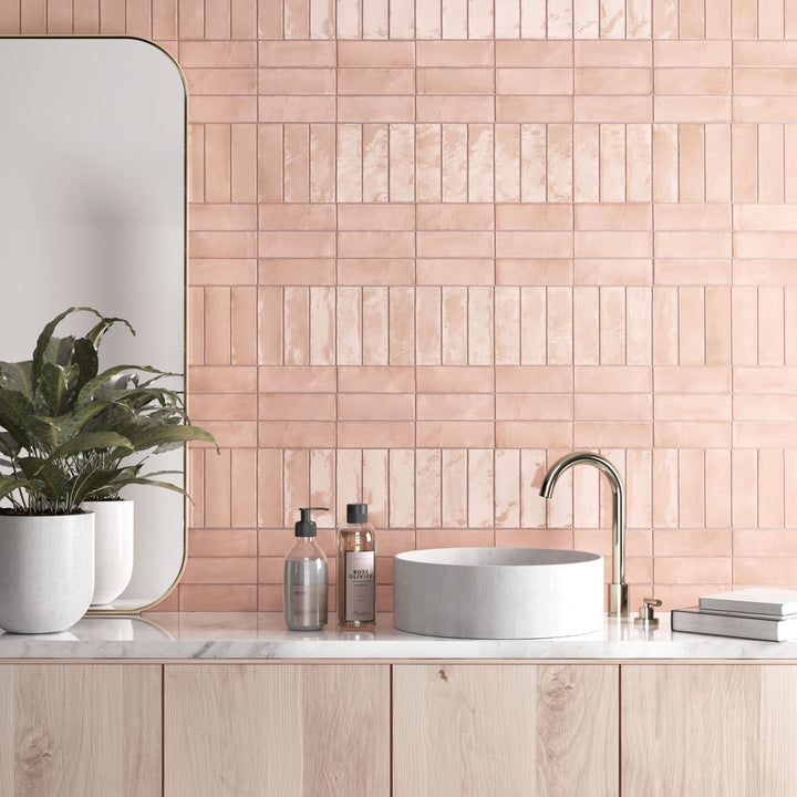 Soft pink tones and a matte porcelain surface create a delicate yet modern touch with Soco Pink 2x6 tile.