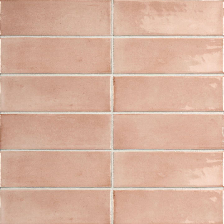 Bird's eye view showcasing the pink soco tile, sized 2x6, with a smooth glaze that enhances its rich pigment.