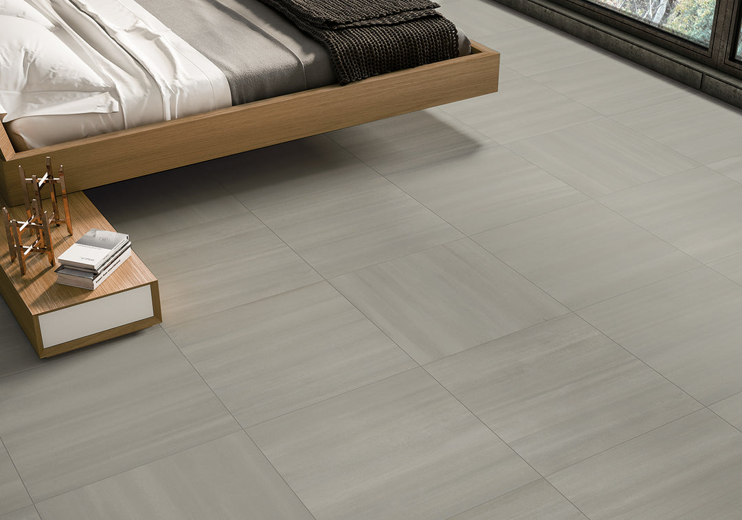 A balanced shade of gray with a smooth matte surface, Flow Gray 12x24 porcelain tile offers a clean and modern style.