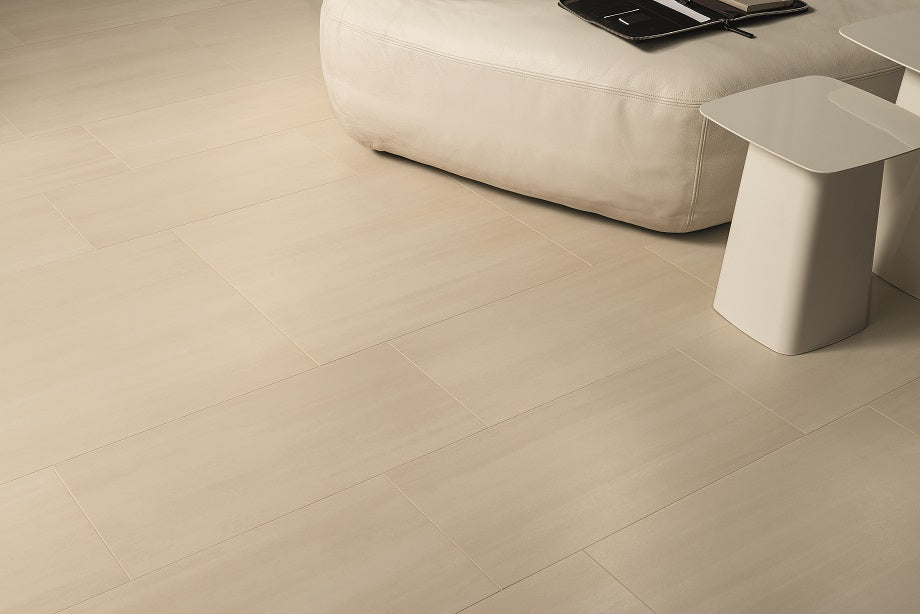 A room scene, featuring beige flow tile with a matte texture, bringing a sleek look to the room.