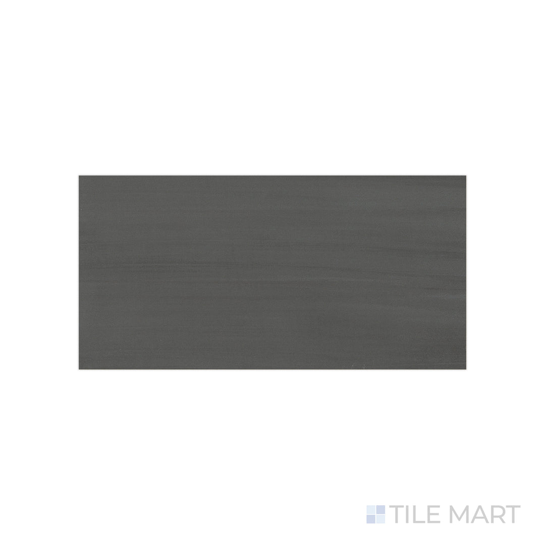 An angled look at the dark gray flow tile, highlighting its glossy finish and the boldness of its soft undertone.