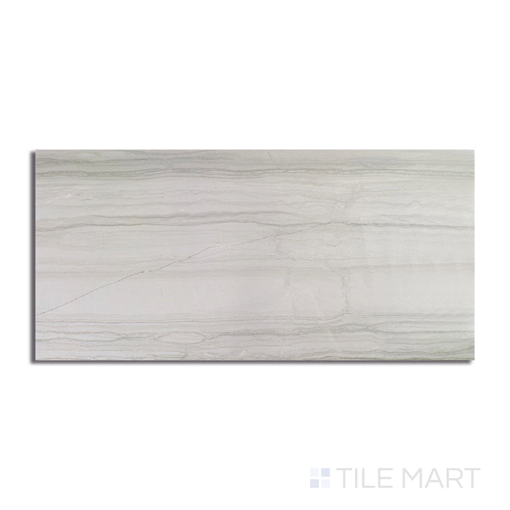 An angled look at the light grey demira tile, highlighting its reflective sheen and the boldness of its deep shade.