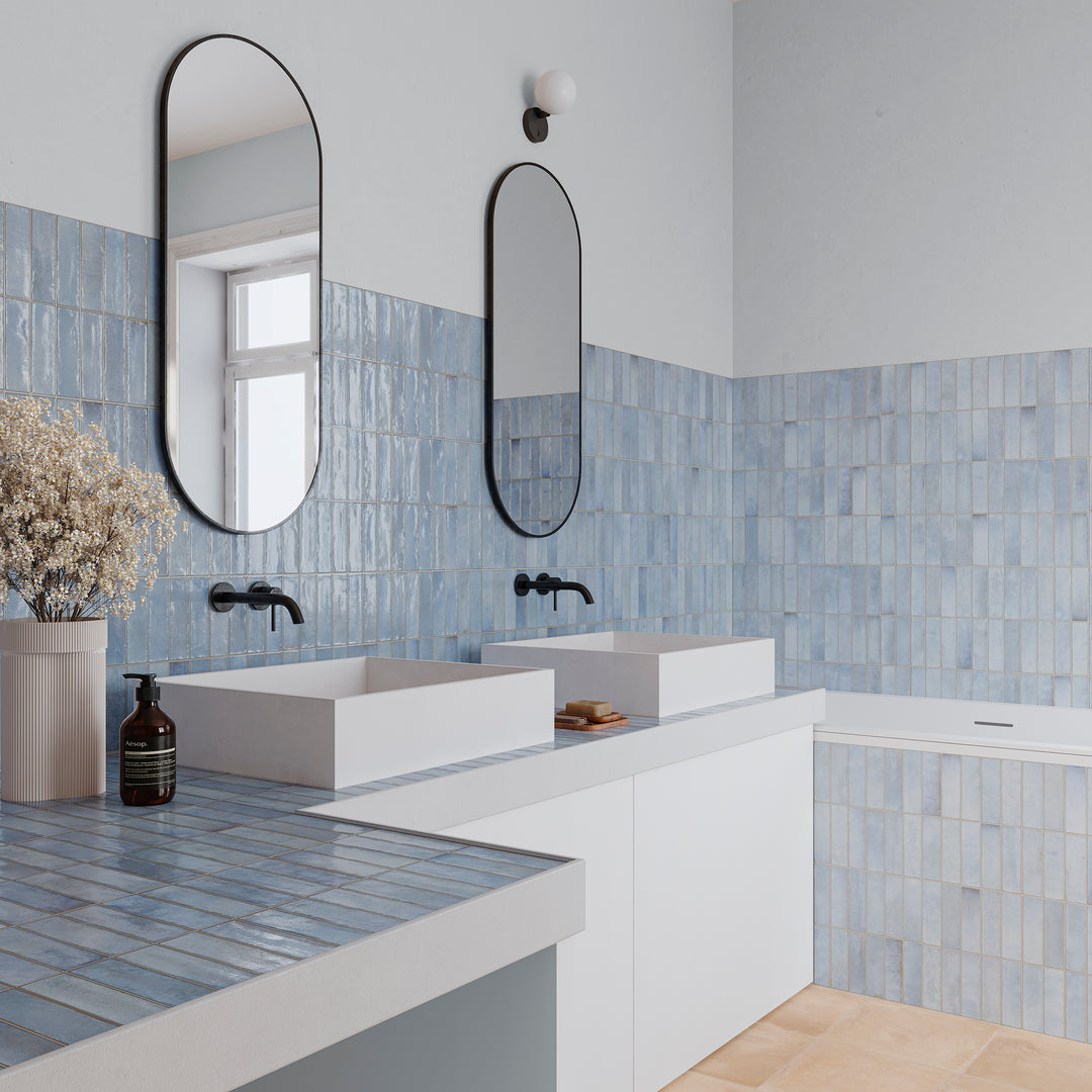 Decoris Artis Light Blue offers a radiant, light-catching character to a glossy porcelain tile wall.