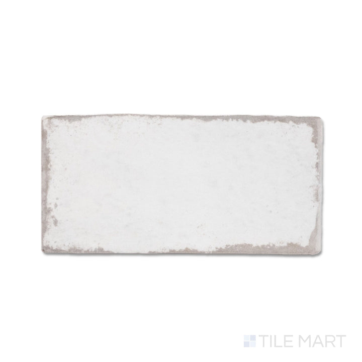 Top-down view of a single Retrospectives Enchanted Mist 3x6 glossy ceramic subway tile showing its soft enchanted mist surface and light-reflective glossy finish detail