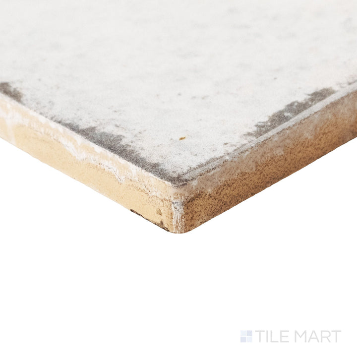 Corner shot of Retrospectives Enchanted Mist 3x6 glossy ceramic subway tile revealing its edge profile and soft enchanted mist glossy surface