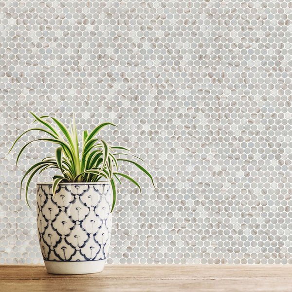 Simple Stone Oro penny round glass mosaic conveying a playful, retro character with its warm oro gold tone and circular glass dot pattern