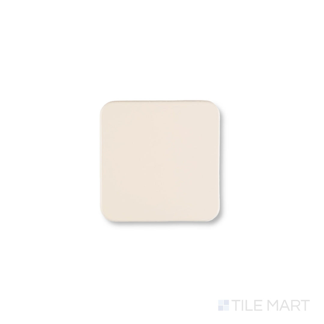 Top-down view of Curves Halo Ivory 6x6 glossy ceramic tile, featuring a smooth ivory surface and elegant finish ideal for modern interiors