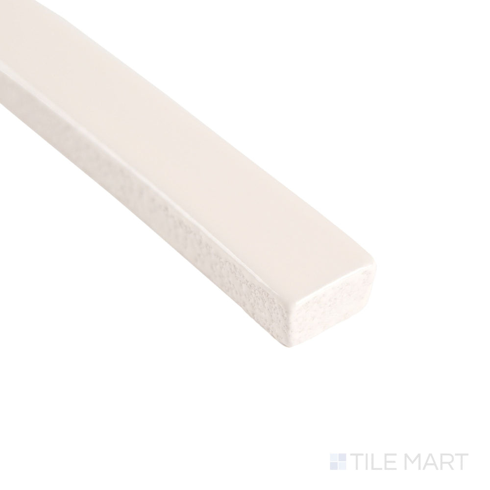 Corner detail of Curves Ivory 5/8x6 glossy ceramic pencil tile, showcasing its glossy ivory glaze and precise edge line