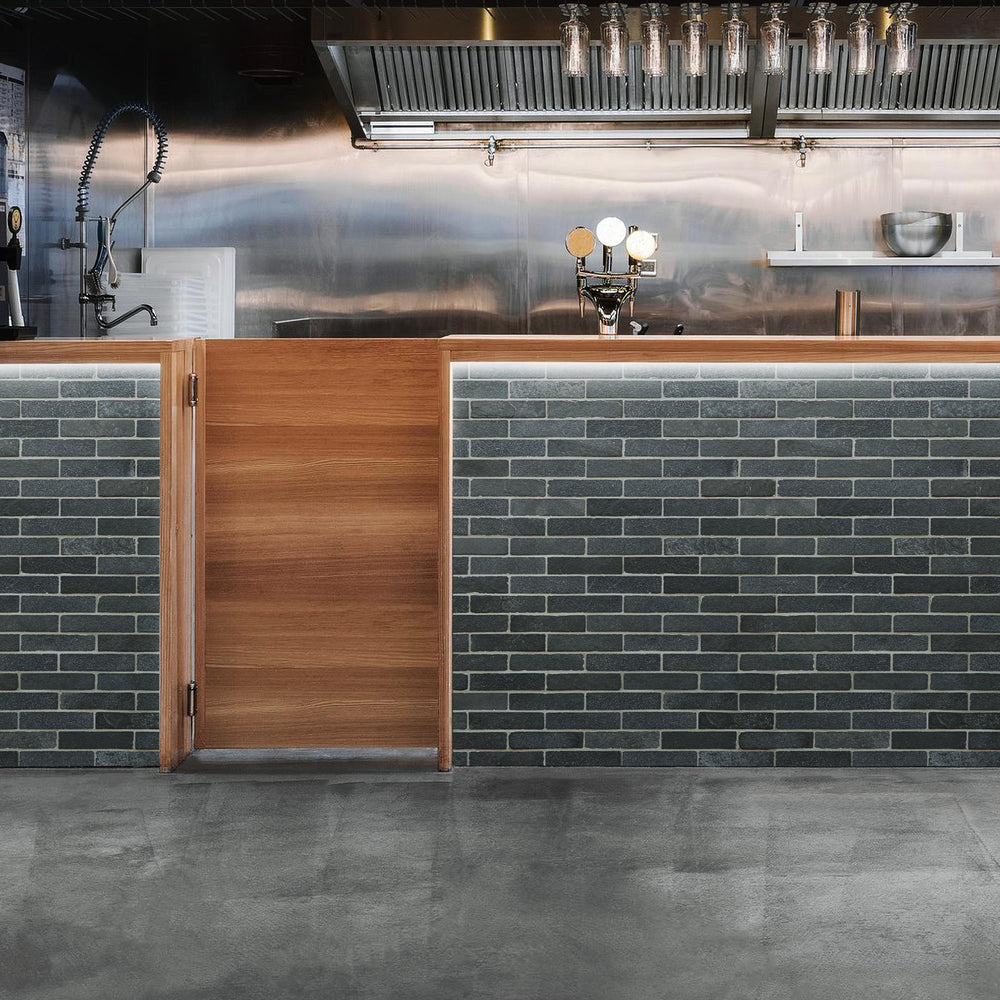 Lime Black thin brick limestone mosaic styled in a modern space with rich texture and natural depth
