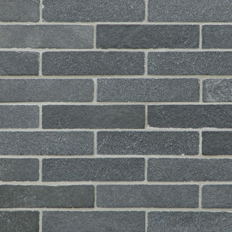 Meshed Lime Black thin brick limestone mosaic with a tumbled finish and natural stone texture