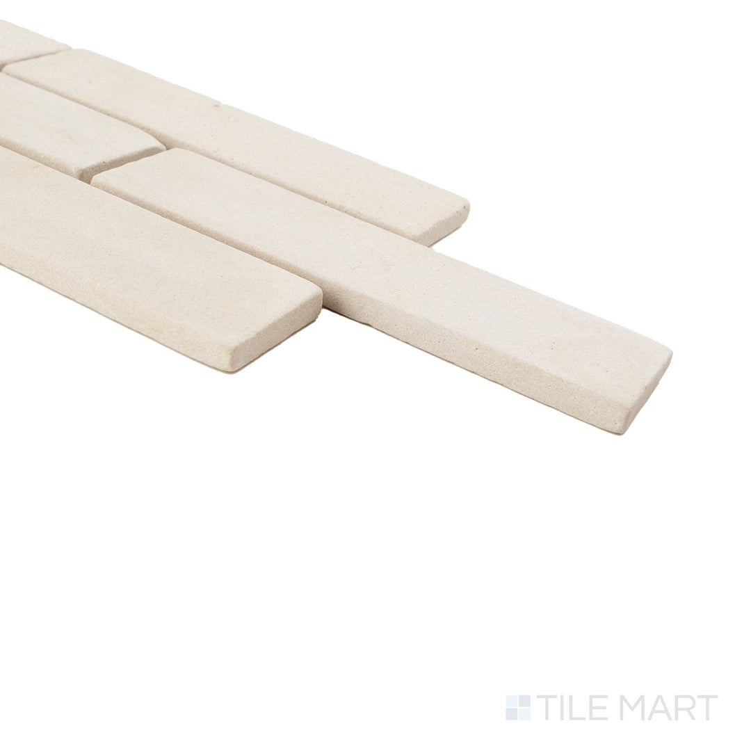 Sedona thin brick sandstone mosaic on mesh shown at corner angle with warm tones and softened edges