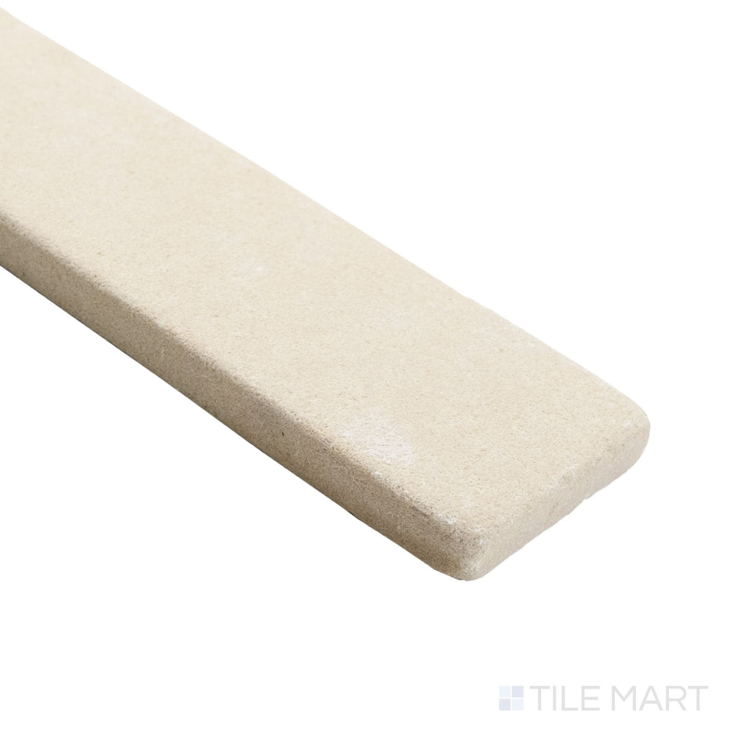 Corner angle of loose Sedona 2x8 thin brick sandstone highlighting weathered surface and natural variation