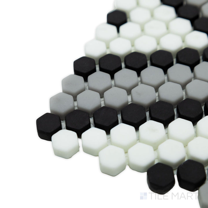 Geometro Amiens Classic 3/8" hexagon matte recycled glass mosaic in a corner shot, showcasing its intricate hexagonal pattern and soft matte finish.