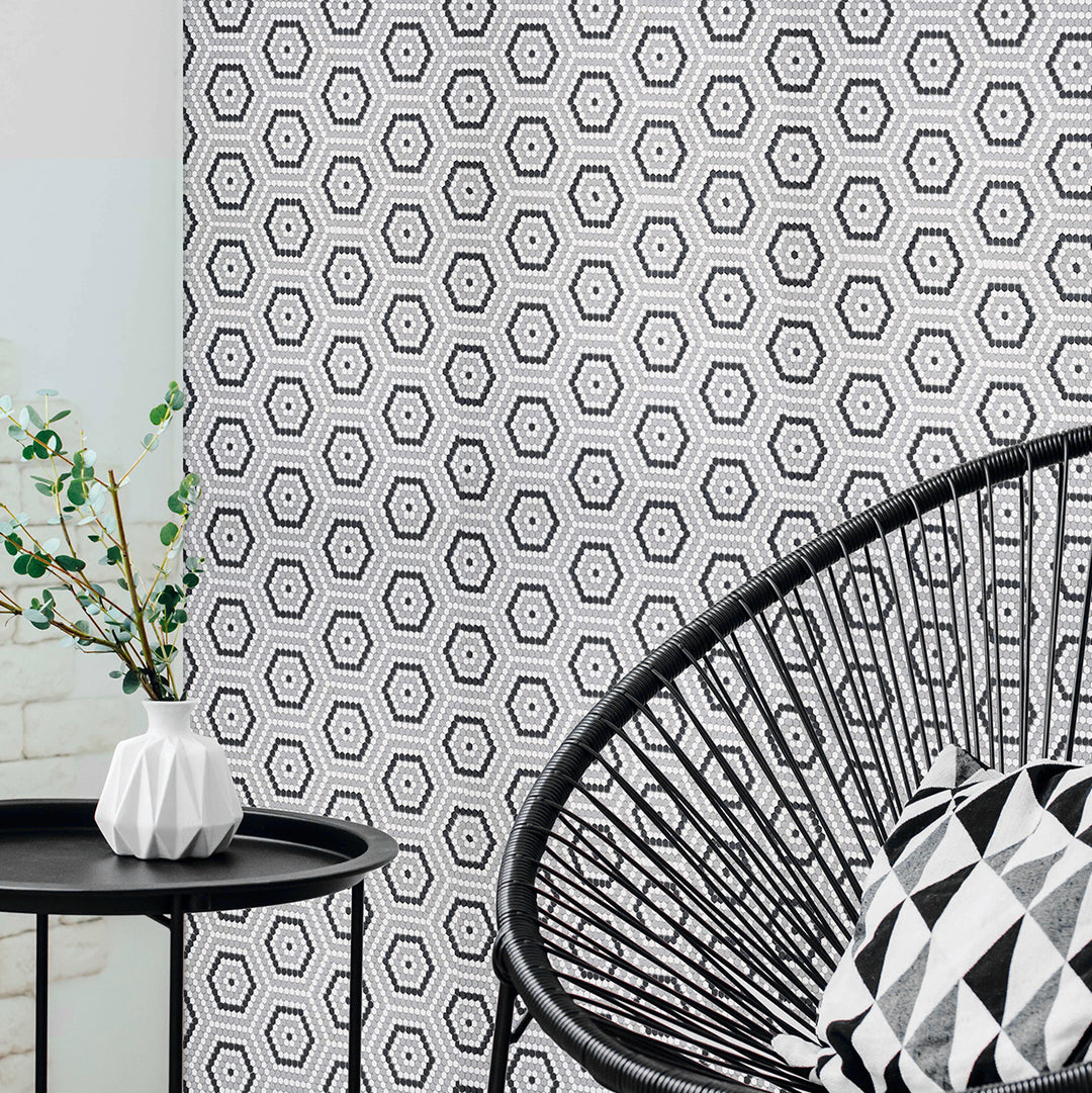Geometric patterned wallpaper with a black and white chair and table in the foreground.