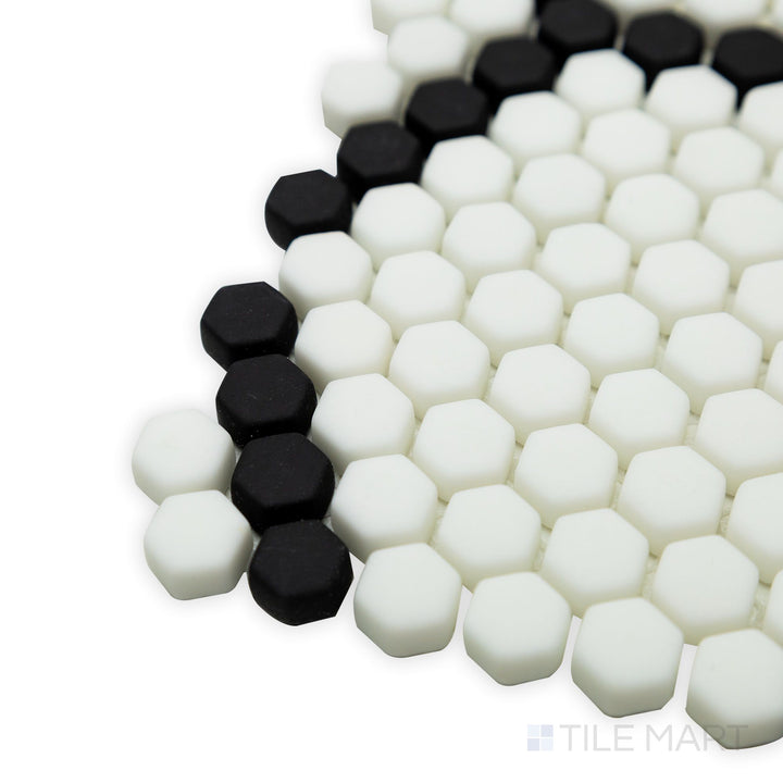 A sophisticated corner view of Geometro Tulle Classic 3/8" hexagon matte recycled glass mosaic, featuring its crisp hexagon pattern and an understated matte texture.
