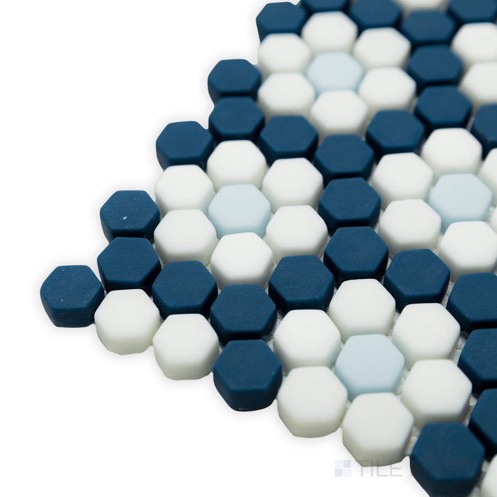 A bold and stylish corner perspective of Geometro Dijon Coastal 3/8" hexagon matte recycled glass mosaic, emphasizing its intricate hexagonal pattern and smooth finish.