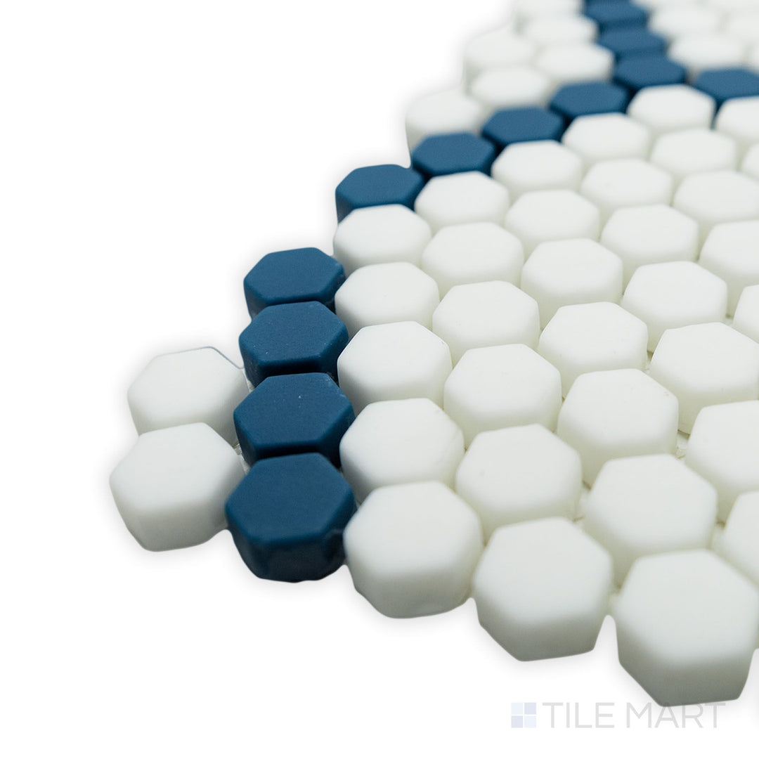 A stylish corner shot highlighting the intricate hexagonal pattern of the Geometro Tulle Coastal 3/8" hexagon matte recycled glass mosaic, featuring soft coastal-inspired hues.