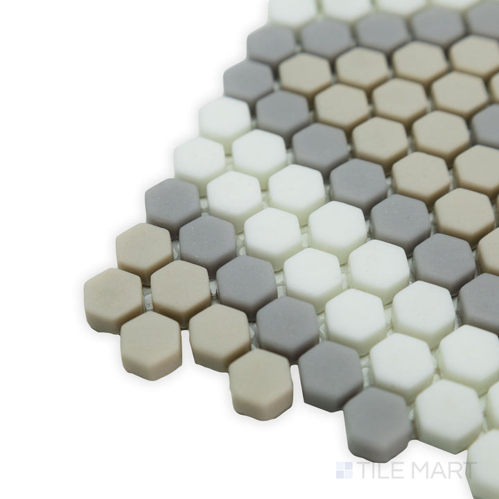 With an earthy color palette and eco-friendly recycled glass composition, this corner shot of the Geometro Amiens Country 3/8" hexagon matte mosaic adds warmth to any space.