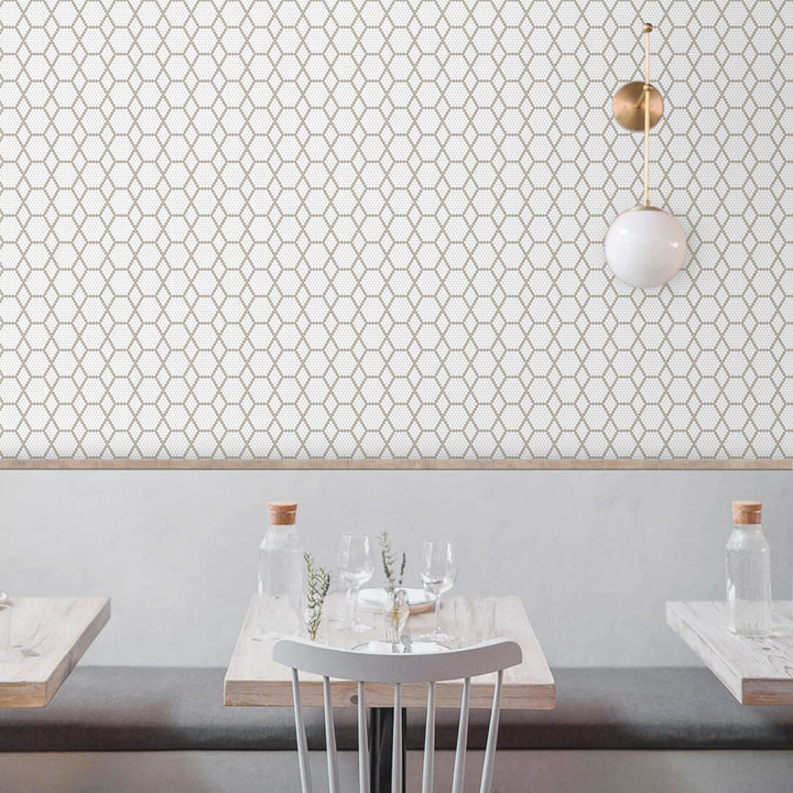 A warm and welcoming interior featuring Geometro Tulle Country 3/8" hexagon matte recycled glass mosaic, creating a cozy yet modern aesthetic.