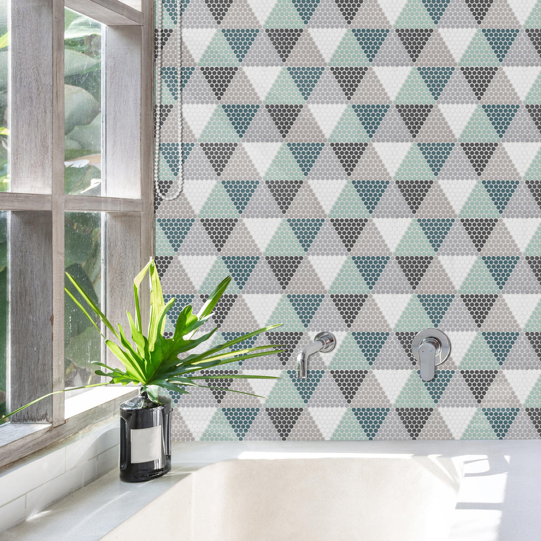 A well-curated space featuring Geometro Hygee Log 1/2" Round Matte Recycled Glass Mosaic, adding a touch of movement and fluidity to the design.