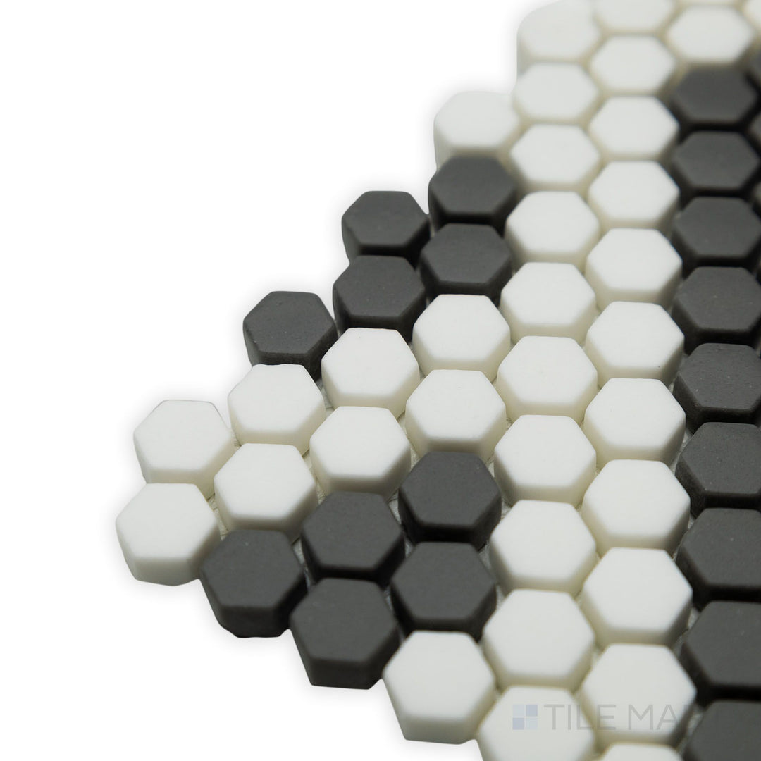 Sharp angles and precise geometric structure define this corner view of the Geometro Missoni Zip 3/8" Hexagon matte recycled glass mosaic, ideal for modern designs.
