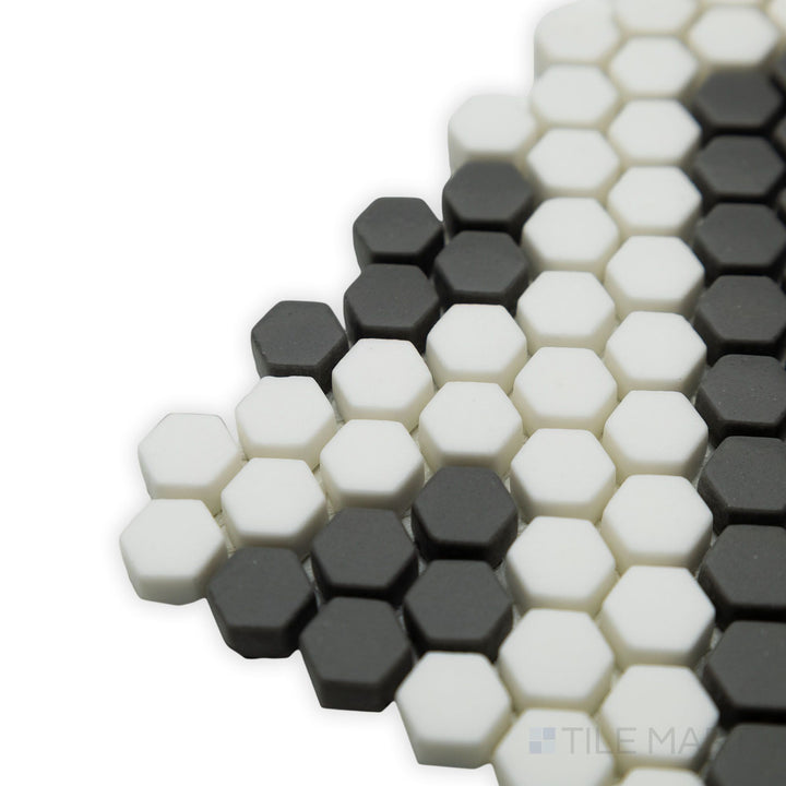 Sharp angles and precise geometric structure define this corner view of the Geometro Missoni Zip 3/8" Hexagon matte recycled glass mosaic, ideal for modern designs.