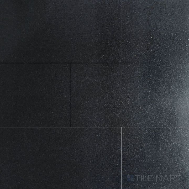 Overview of Absolute Black Granite 12x24 honed tile, featuring a smooth, matte finish with uniform black tone ideal for modern interiors.