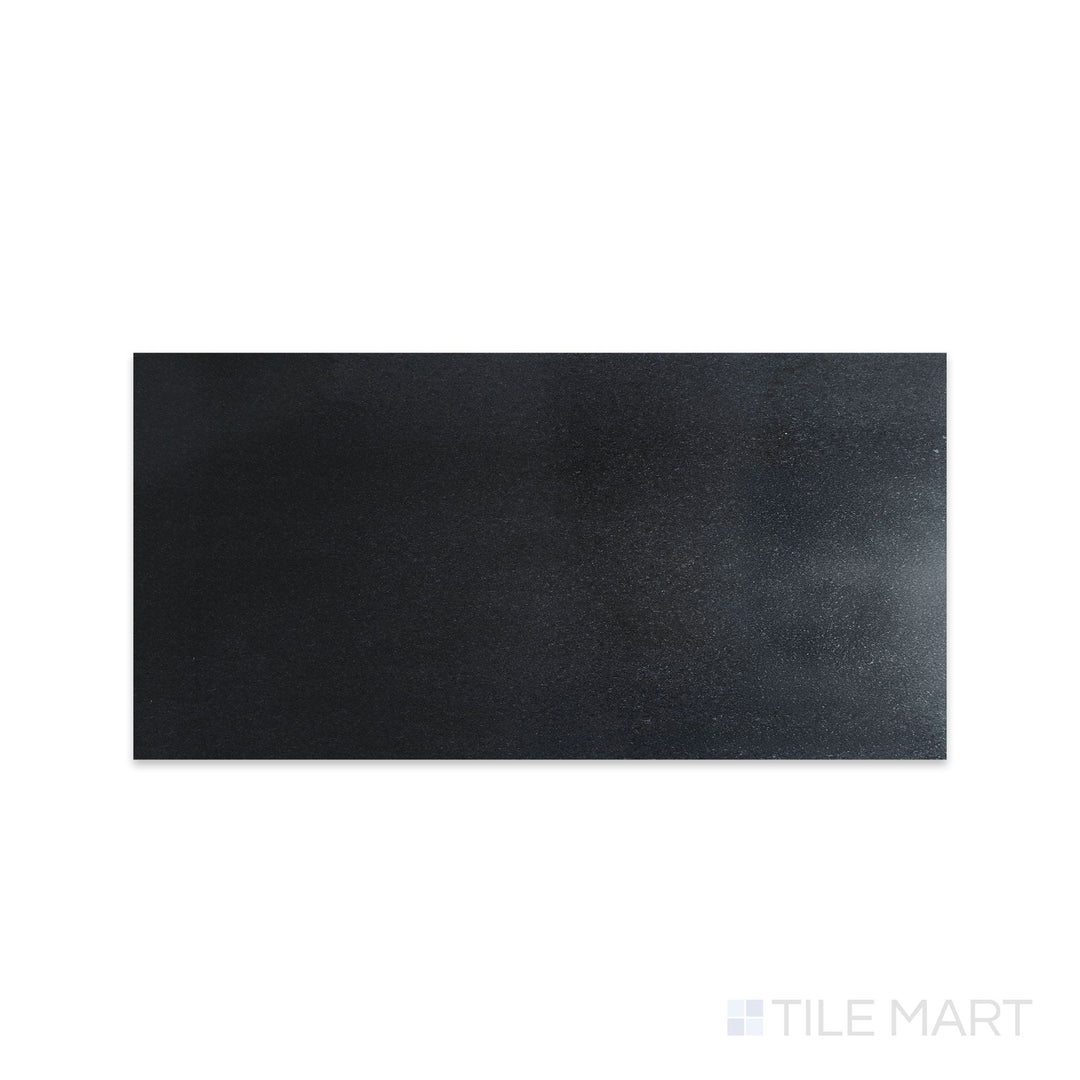 Overhead image of Absolute Black Granite 12x24 honed tile, featuring a smooth, matte black surface with subtle depth and minimal reflection.