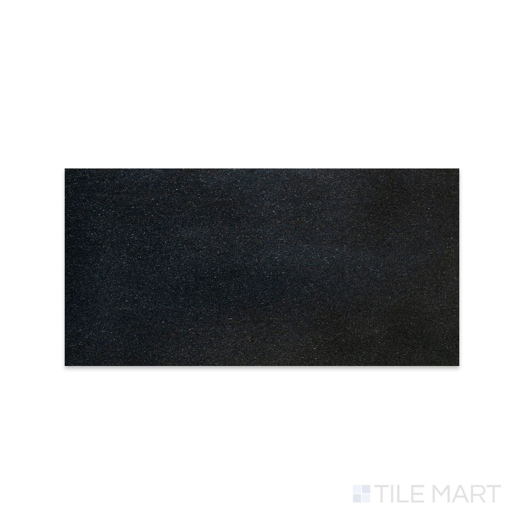 Flat-lay photo of Absolute Black Granite 12x24 polished tile, presenting a high-gloss jet-black finish with mirror-like reflection.