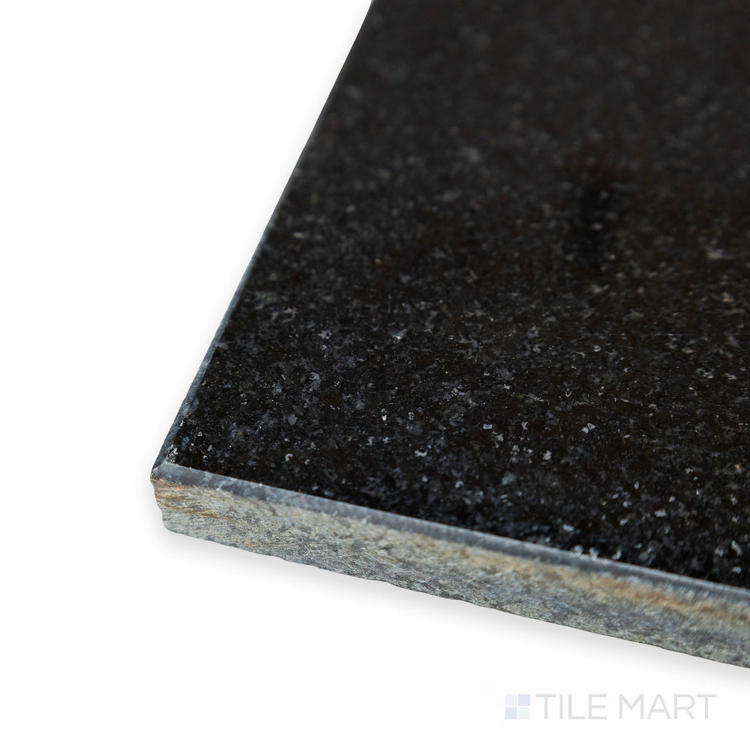Corner detail of Absolute Black Granite 18x18 polished tile highlighting reflective finish and deep black clarity.