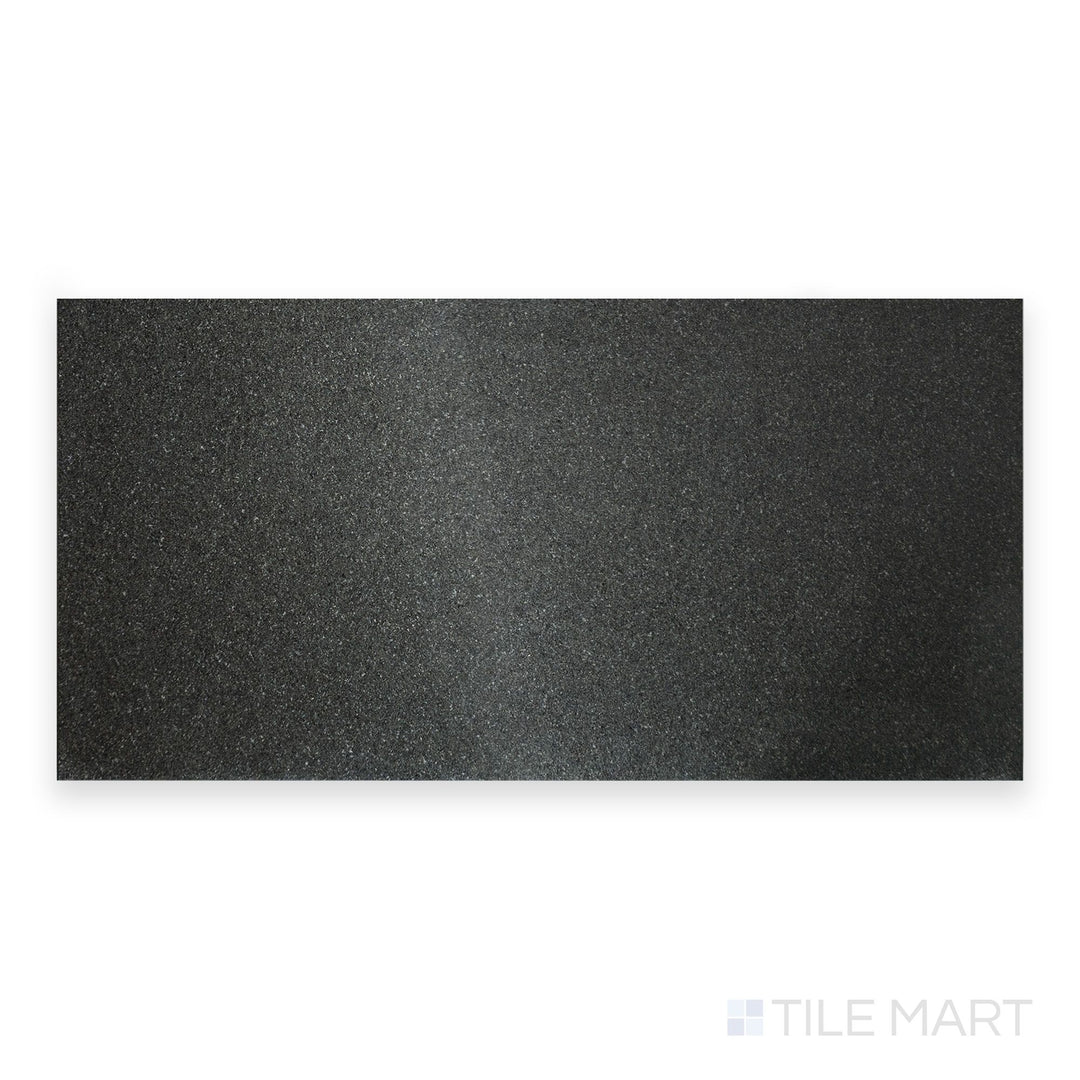 A close-up of Absolute Black Granite 18X36 Flamed, highlighting its textured surface with a natural flamed finish.