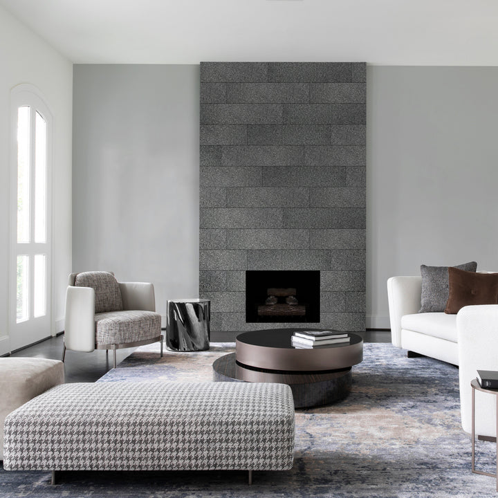 A spacious contemporary interior featuring Absolute Black Granite 18X36 Flamed, offering a bold, natural stone texture that enhances the space with a rugged yet elegant appeal.