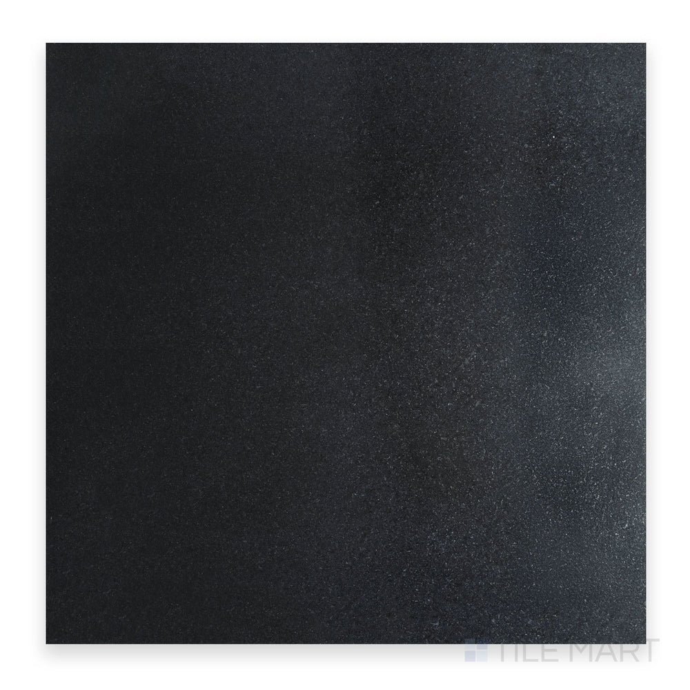 Zoomed-in shot of Absolute Black Granite 24X24 Honed, emphasizing its smooth matte finish and rich dark surface.