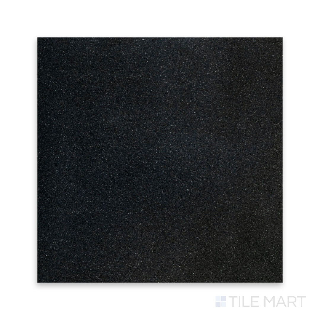 A crisp close-up of Absolute Black Granite 24X24 Polished, featuring its reflective finish and deep black elegance.