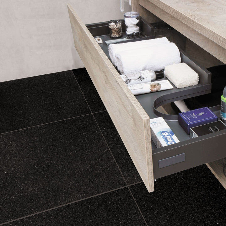 A polished and modern space showcasing Absolute Black Granite 24X24 Polished, reflecting light beautifully while adding depth and sophistication to the setting.