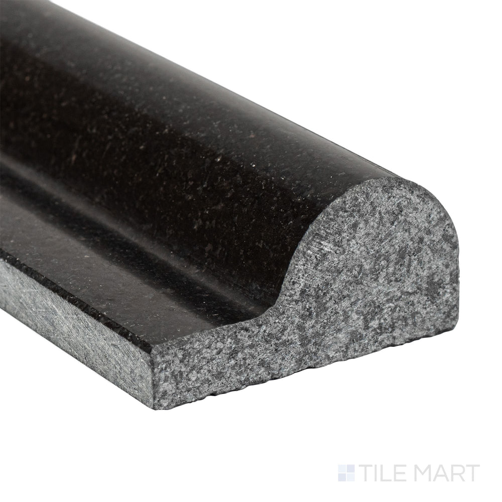 Corner close-up of Absolute Black Granite 2x12 polished classic chair rail showing sleek edge and high-gloss finish.